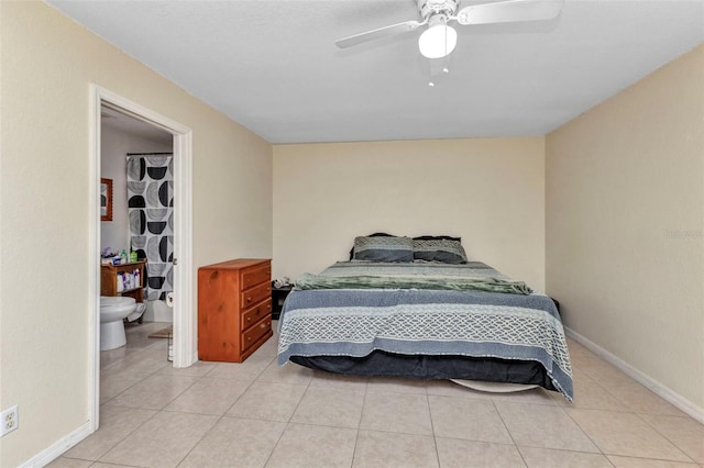 6344 Hera St, Englewood, FL 34224 - bedroom with a walk in closet, a ceiling fan, baseboards, and light tile patterned floors