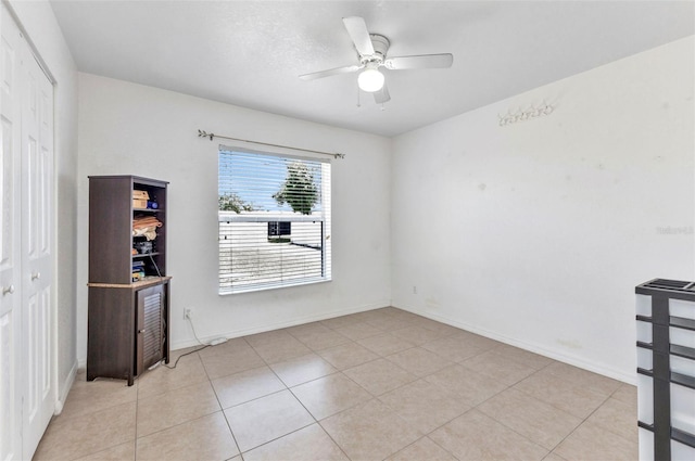 6344 Hera St, Englewood, FL 34224 - unfurnished room featuring light tile patterned flooring, a ceiling fan, and baseboards