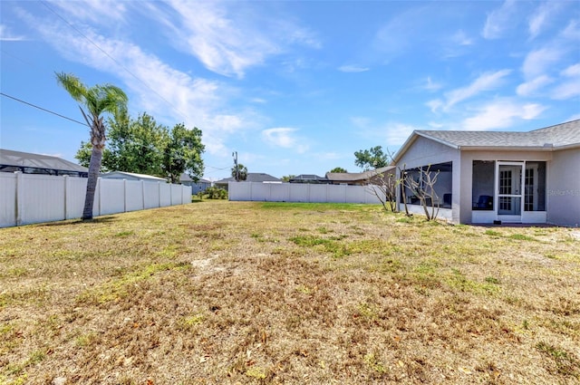 6344 Hera St, Englewood, FL 34224 - view of yard with a sunroom and a fenced backyard