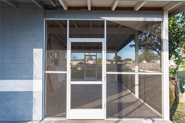 property entrance with concrete block siding