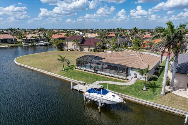drone / aerial view with a residential view and a water view