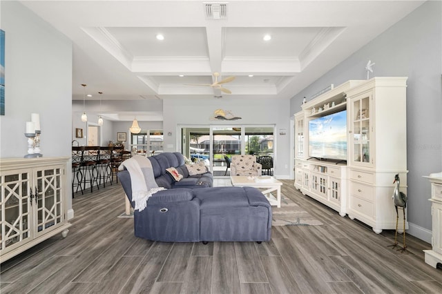 living room featuring visible vents, beamed ceiling, baseboards, wood finished floors, and coffered ceiling