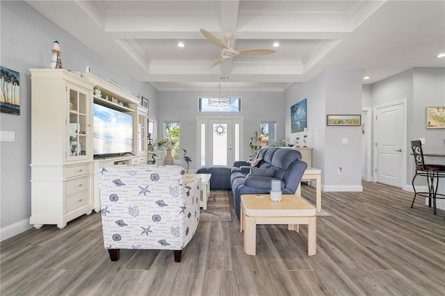 living area with wood finished floors, baseboards, and ceiling fan