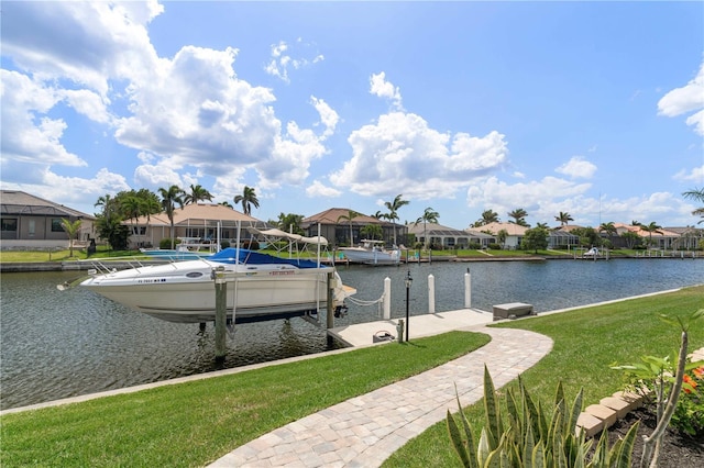 dock area with boat lift, a residential view, a water view, and a lawn