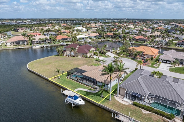 bird's eye view featuring a residential view and a water view