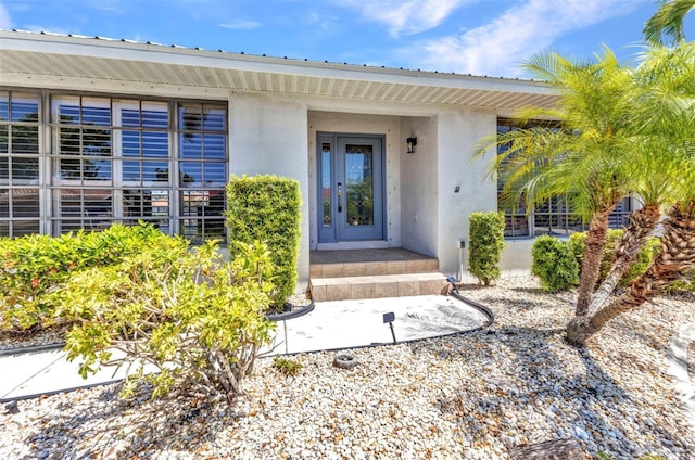 2718 Saint Thomas Dr, Punta Gorda, FL 33950 - property entrance featuring metal roof and stucco siding