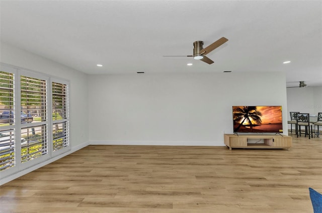 2718 Saint Thomas Dr, Punta Gorda, FL 33950 - unfurnished living room featuring recessed lighting, light wood finished floors, and a ceiling fan