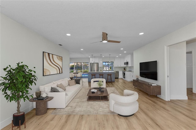 2718 Saint Thomas Dr, Punta Gorda, FL 33950 - living area with recessed lighting, light wood-type flooring, baseboards, and ceiling fan