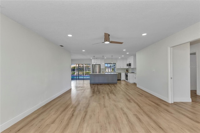 2718 Saint Thomas Dr, Punta Gorda, FL 33950 - unfurnished living room featuring recessed lighting, light wood-style flooring, a ceiling fan, and baseboards