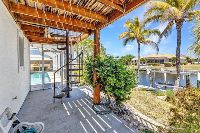 2718 Saint Thomas Dr, Punta Gorda, FL 33950 - view of patio featuring an outdoor pool, a dock, boat lift, and a water view