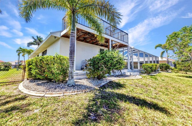 2718 Saint Thomas Dr, Punta Gorda, FL 33950 - exterior space featuring a lawn, stucco siding, and fence