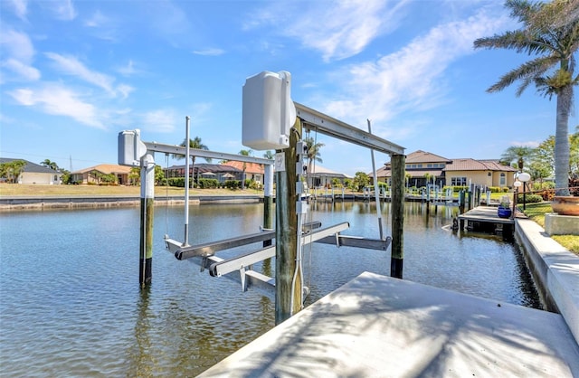 2718 Saint Thomas Dr, Punta Gorda, FL 33950 - dock area featuring boat lift, a residential view, and a water view