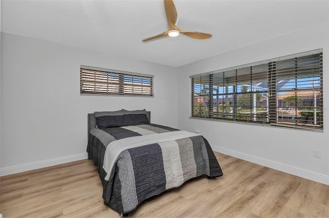 2718 Saint Thomas Dr, Punta Gorda, FL 33950 - bedroom with wood finished floors, baseboards, and a ceiling fan