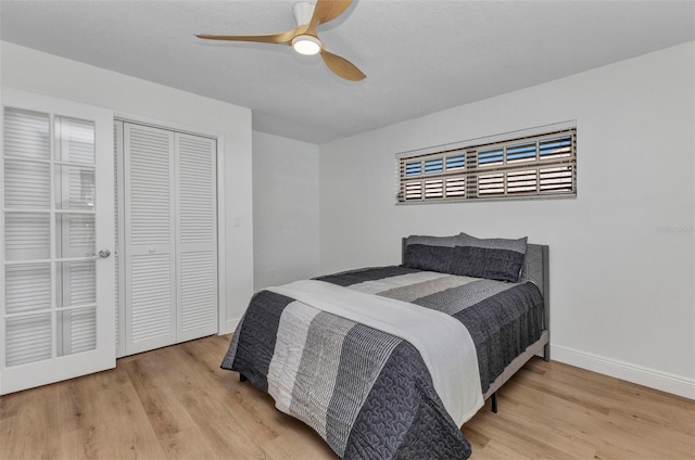 2718 Saint Thomas Dr, Punta Gorda, FL 33950 - bedroom with baseboards, a ceiling fan, wood finished floors, and a closet