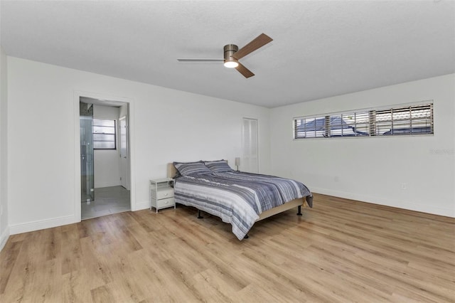 2718 Saint Thomas Dr, Punta Gorda, FL 33950 - bedroom featuring light wood-type flooring, ensuite bath, and baseboards