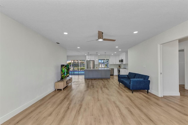 2718 Saint Thomas Dr, Punta Gorda, FL 33950 - sitting room featuring light wood finished floors, baseboards, recessed lighting, and ceiling fan