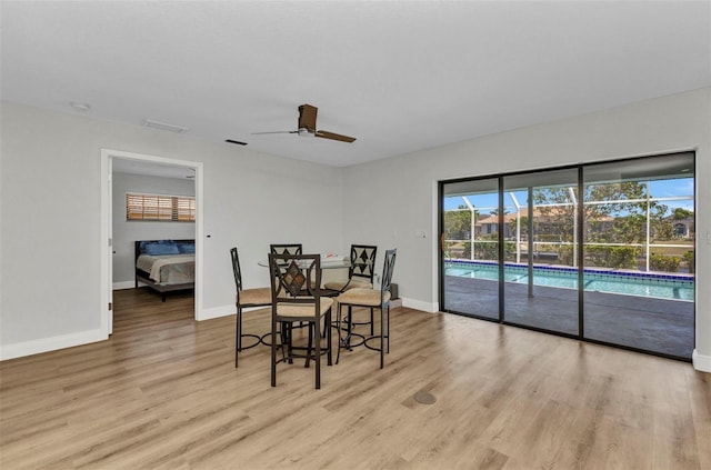 2718 Saint Thomas Dr, Punta Gorda, FL 33950 - dining room with light wood-type flooring, baseboards, ceiling fan, and visible vents