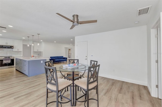 2718 Saint Thomas Dr, Punta Gorda, FL 33950 - dining space featuring light wood-type flooring, baseboards, visible vents, recessed lighting, and a ceiling fan