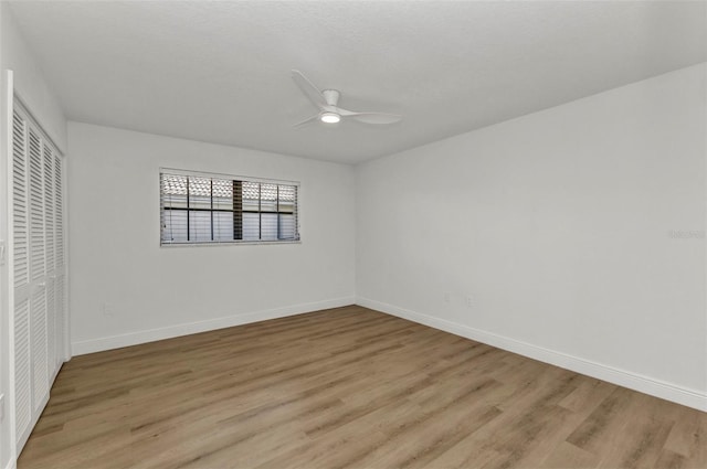 2718 Saint Thomas Dr, Punta Gorda, FL 33950 - unfurnished bedroom with ceiling fan, baseboards, light wood finished floors, and a closet