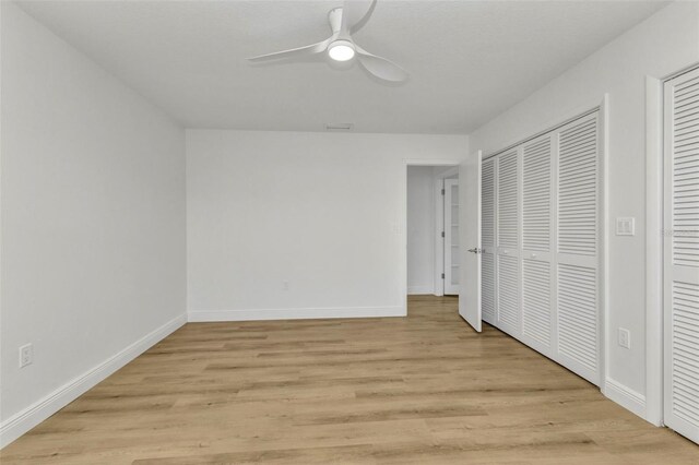 2718 Saint Thomas Dr, Punta Gorda, FL 33950 - unfurnished bedroom featuring light wood finished floors, a ceiling fan, and baseboards