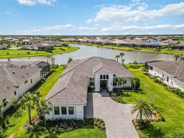 bird's eye view featuring a residential view and a water view