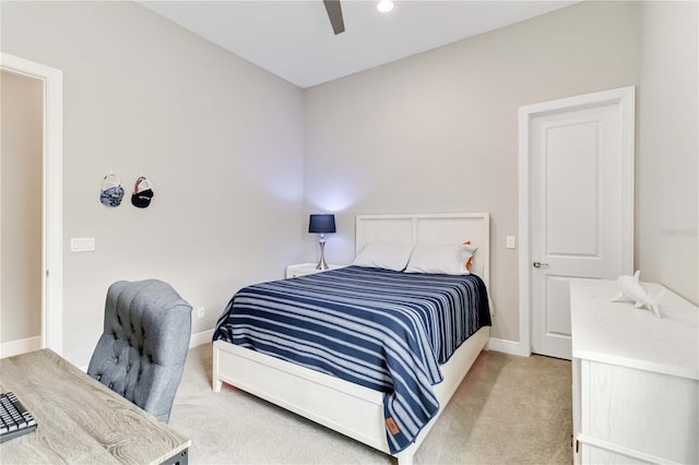carpeted bedroom with baseboards and ceiling fan