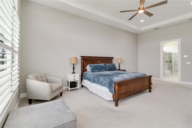 bedroom with light colored carpet, recessed lighting, baseboards, connected bathroom, and visible vents