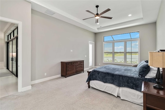 carpeted bedroom with a raised ceiling, baseboards, visible vents, ceiling fan, and recessed lighting
