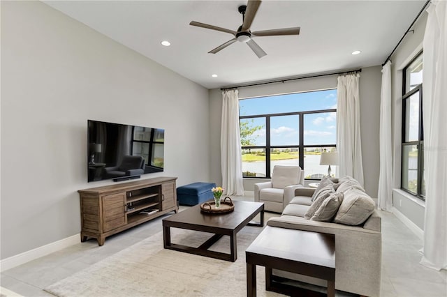 living area featuring baseboards, recessed lighting, and a ceiling fan