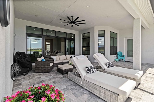 view of patio / terrace with an outdoor living space and a ceiling fan