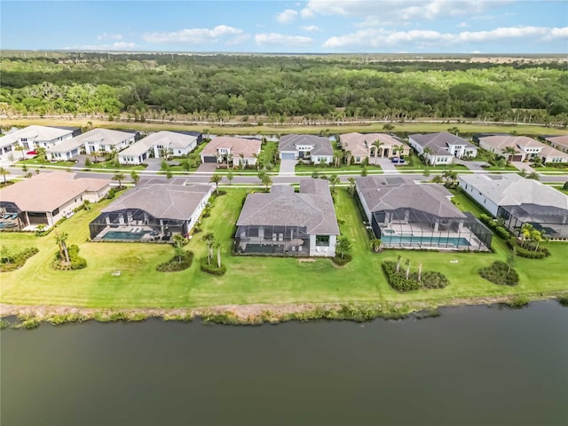 birds eye view of property with a residential view and a water view