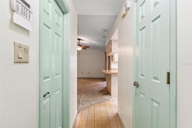2192 Hyatt Dr, Port Charlotte, FL 33948 - hallway with tile patterned floors, carpet flooring, and baseboards