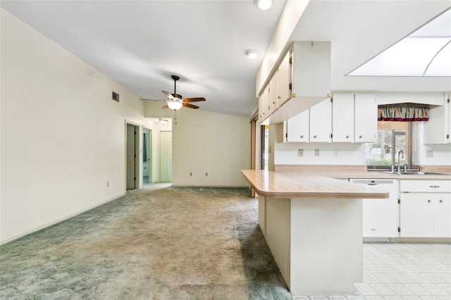 2192 Hyatt Dr, Port Charlotte, FL 33948 - kitchen with white dishwasher, a sink, a ceiling fan, a peninsula, and lofted ceiling