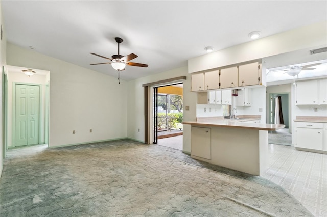 2192 Hyatt Dr, Port Charlotte, FL 33948 - kitchen featuring visible vents, a sink, light countertops, a ceiling fan, and lofted ceiling