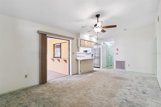 2192 Hyatt Dr, Port Charlotte, FL 33948 - unfurnished living room featuring visible vents, light colored carpet, baseboards, and ceiling fan