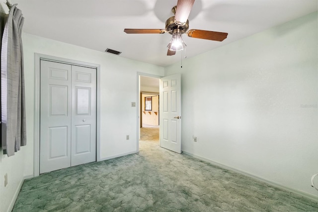 2192 Hyatt Dr, Port Charlotte, FL 33948 - unfurnished bedroom featuring a closet, baseboards, a ceiling fan, carpet floors, and visible vents
