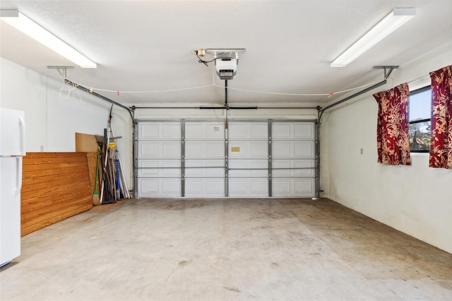 2192 Hyatt Dr, Port Charlotte, FL 33948 - garage with freestanding refrigerator and a garage door opener
