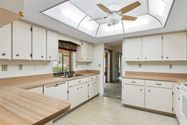 2192 Hyatt Dr, Port Charlotte, FL 33948 - kitchen with white appliances, light countertops, a sink, and light floors