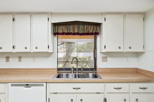 2192 Hyatt Dr, Port Charlotte, FL 33948 - kitchen featuring light countertops, a sink, white cabinetry, and white dishwasher