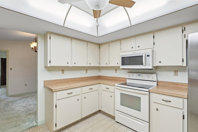 2192 Hyatt Dr, Port Charlotte, FL 33948 - kitchen with white appliances, ceiling fan, light countertops, and light floors