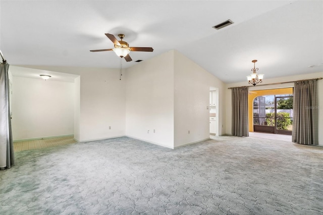2192 Hyatt Dr, Port Charlotte, FL 33948 - carpeted empty room with visible vents, ceiling fan with notable chandelier, baseboards, and lofted ceiling