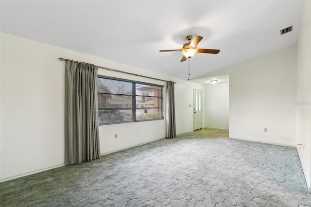 2192 Hyatt Dr, Port Charlotte, FL 33948 - spare room featuring light colored carpet, vaulted ceiling, a ceiling fan, and visible vents