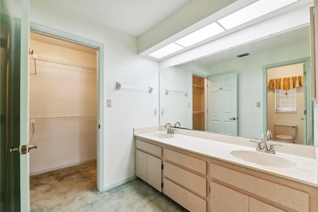2192 Hyatt Dr, Port Charlotte, FL 33948 - full bath with double vanity, visible vents, a sink, and toilet