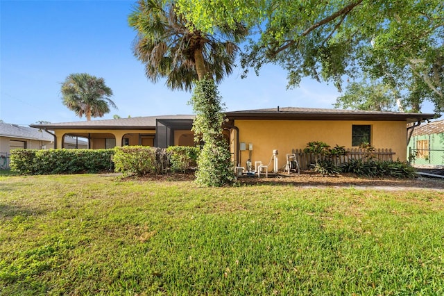 2192 Hyatt Dr, Port Charlotte, FL 33948 - back of property featuring a yard and stucco siding