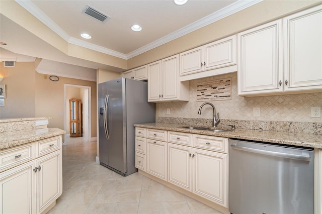 1326 Wesley Dr Unit 123, Punta Gorda, FL 33950 - kitchen featuring tasteful backsplash, visible vents, a sink, appliances with stainless steel finishes, and crown molding