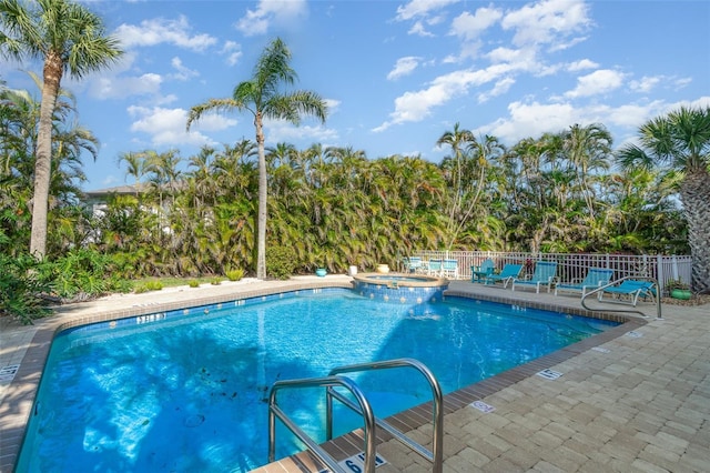 1326 Wesley Dr Unit 123, Punta Gorda, FL 33950 - view of pool featuring a patio area, a pool with connected hot tub, and fence