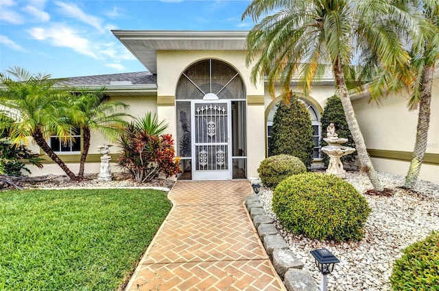 23104 Turnbull Ave, Port Charlotte, FL 33954 - entrance to property with roof with shingles and stucco siding