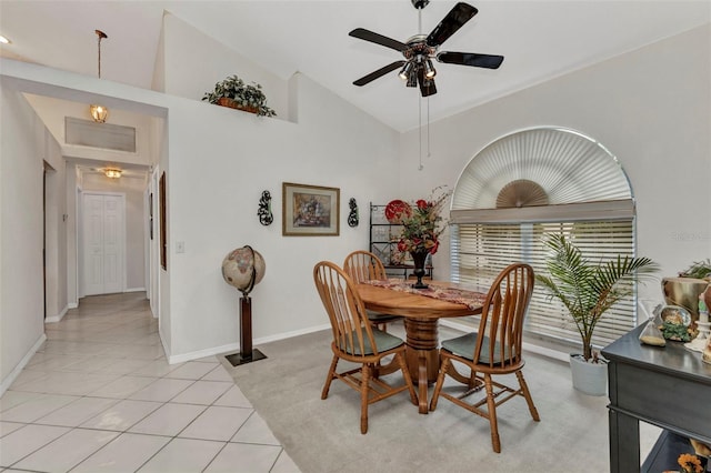 23104 Turnbull Ave, Port Charlotte, FL 33954 - dining room with high vaulted ceiling, baseboards, a ceiling fan, and light tile patterned flooring
