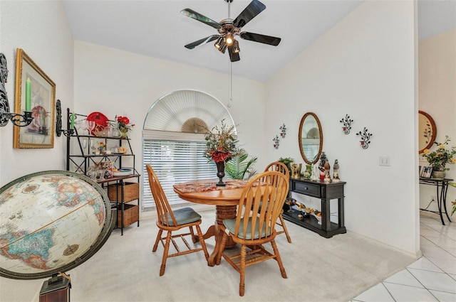23104 Turnbull Ave, Port Charlotte, FL 33954 - dining space featuring light colored carpet, a ceiling fan, vaulted ceiling, light tile patterned flooring, and baseboards