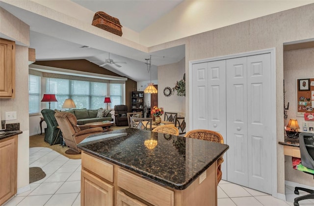 23104 Turnbull Ave, Port Charlotte, FL 33954 - kitchen with lofted ceiling, light brown cabinets, light tile patterned floors, open floor plan, and ceiling fan